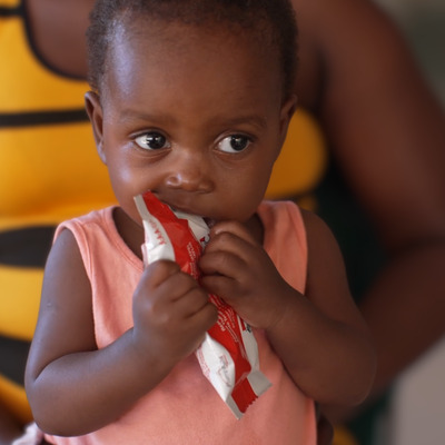 Child eating MFK's Plumpynut