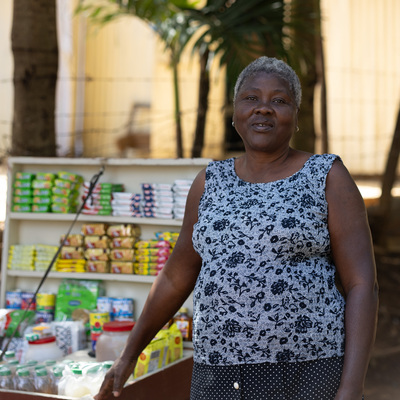 Woman Entrepreneur Displaying Goods for Sale